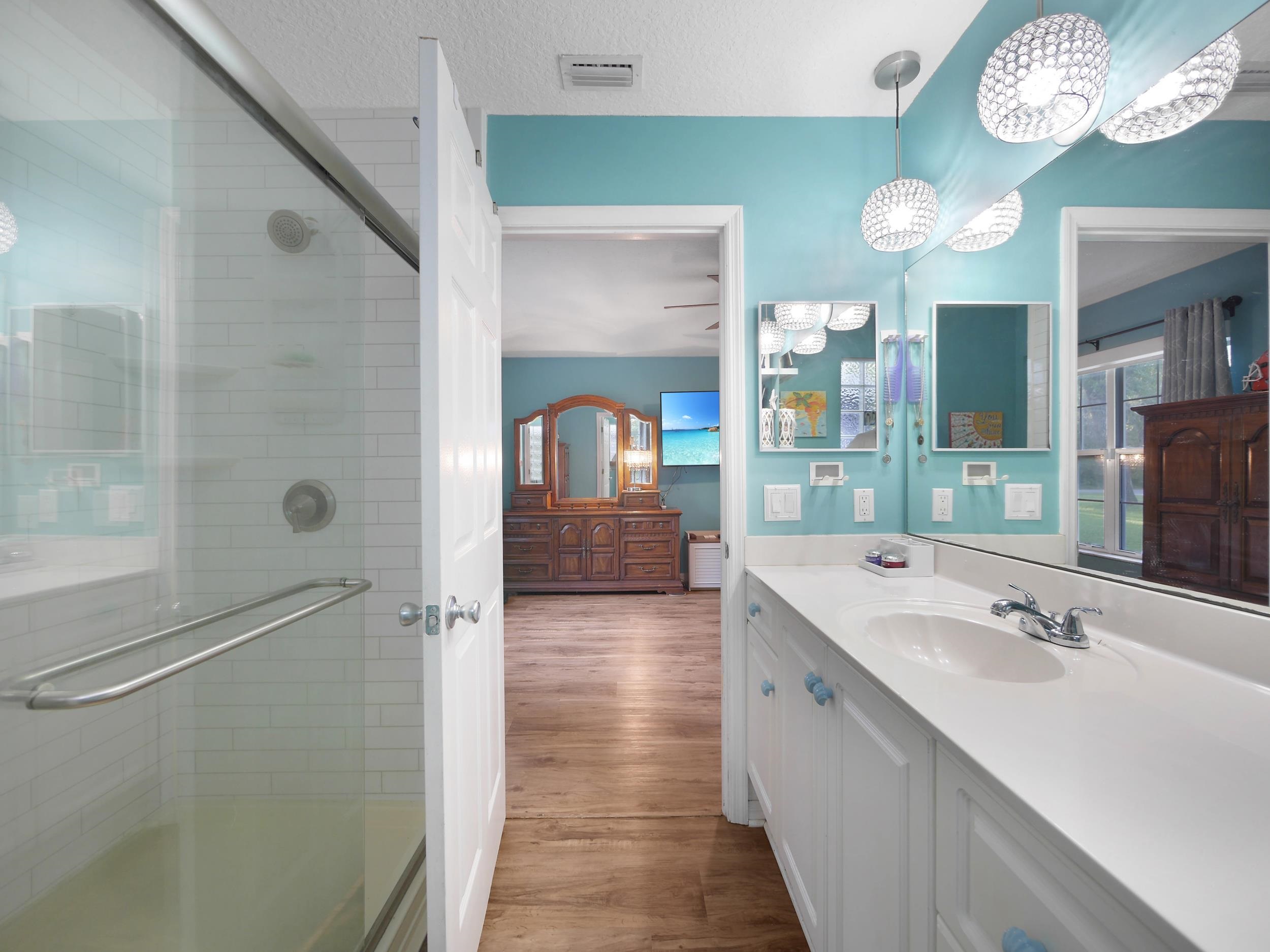 549 Willow Walk Place St. Augustine, FL 32086 - Photo 16 of 32 a bathroom with a double vanity sink mirror and shower