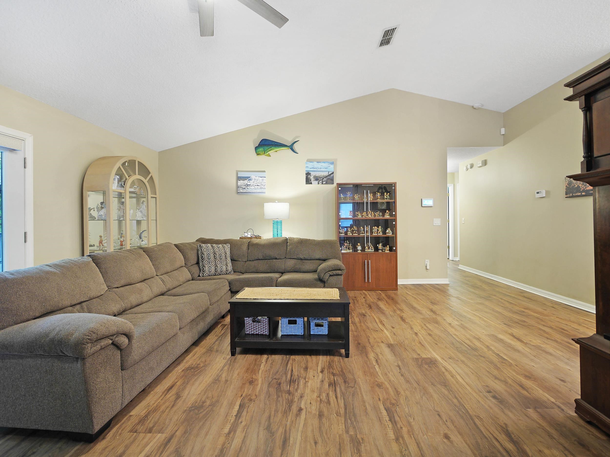 549 Willow Walk Place St. Augustine, FL 32086 - Photo 23 of 32 a living room with furniture and wooden floor