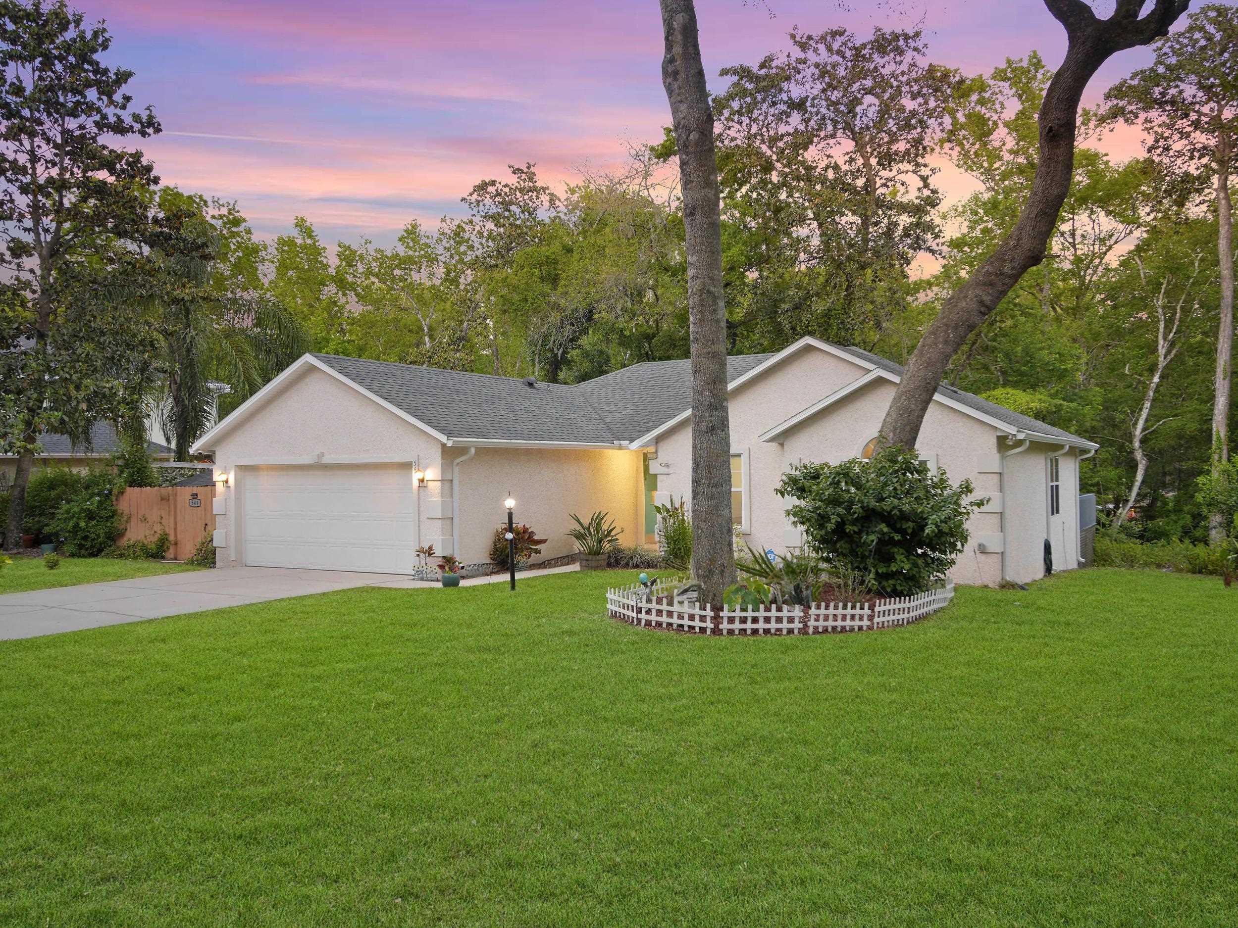 549 Willow Walk Place St. Augustine, FL 32086 - Photo 32 of 32 a front view of a house with a yard and garage