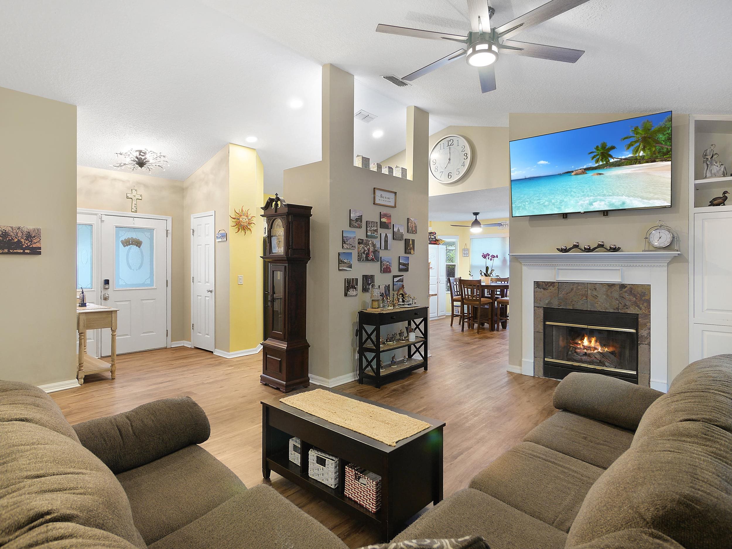 549 Willow Walk Place St. Augustine, FL 32086 - Photo 6 of 32 a living room with furniture and a fireplace