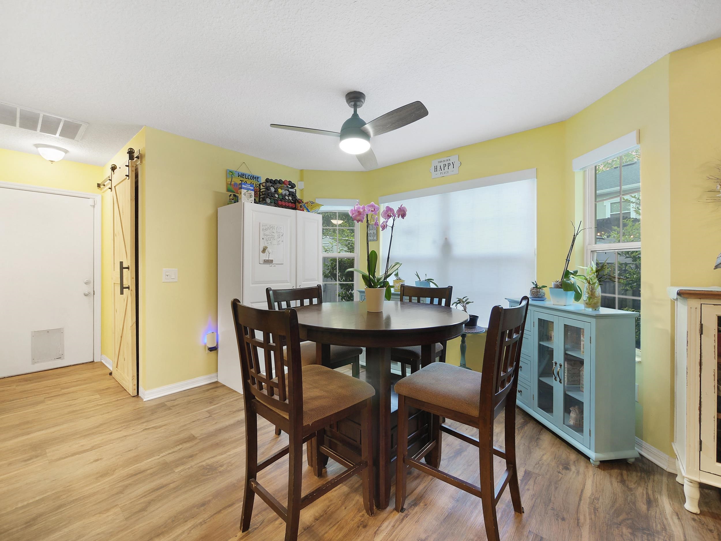 549 Willow Walk Place St. Augustine, FL 32086 - Photo 10 of 32 a view of a dining room with furniture and wooden floor