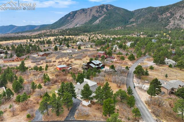 4385 Sandstone Road Monument, CO 80132 - Photo 49 of 50 Aerial view of property and surrounding area with a mountain backdrop