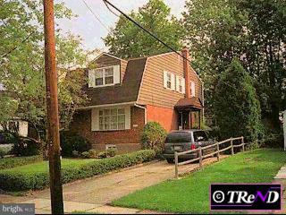 718 Hood Road Swarthmore, PA 19081 - Photo 1 of 1 a front view of a house with garden