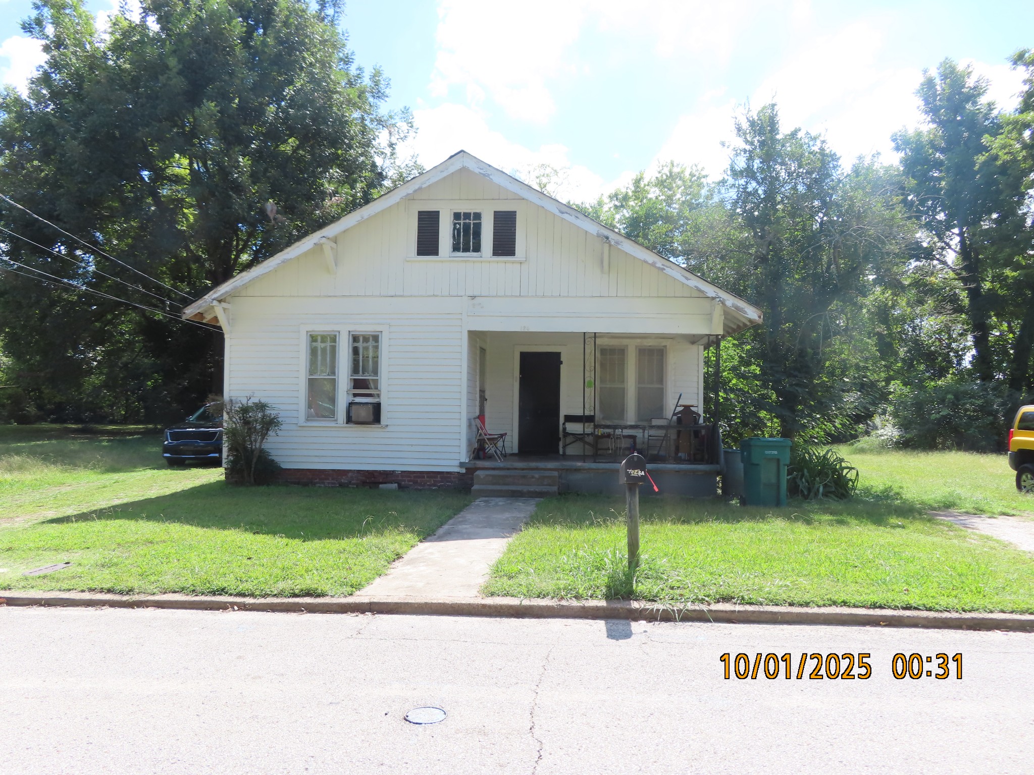 124 Taylor Street Jackson, TN 38301 - Photo 1 of 10 a front view of a house with a yard and garage