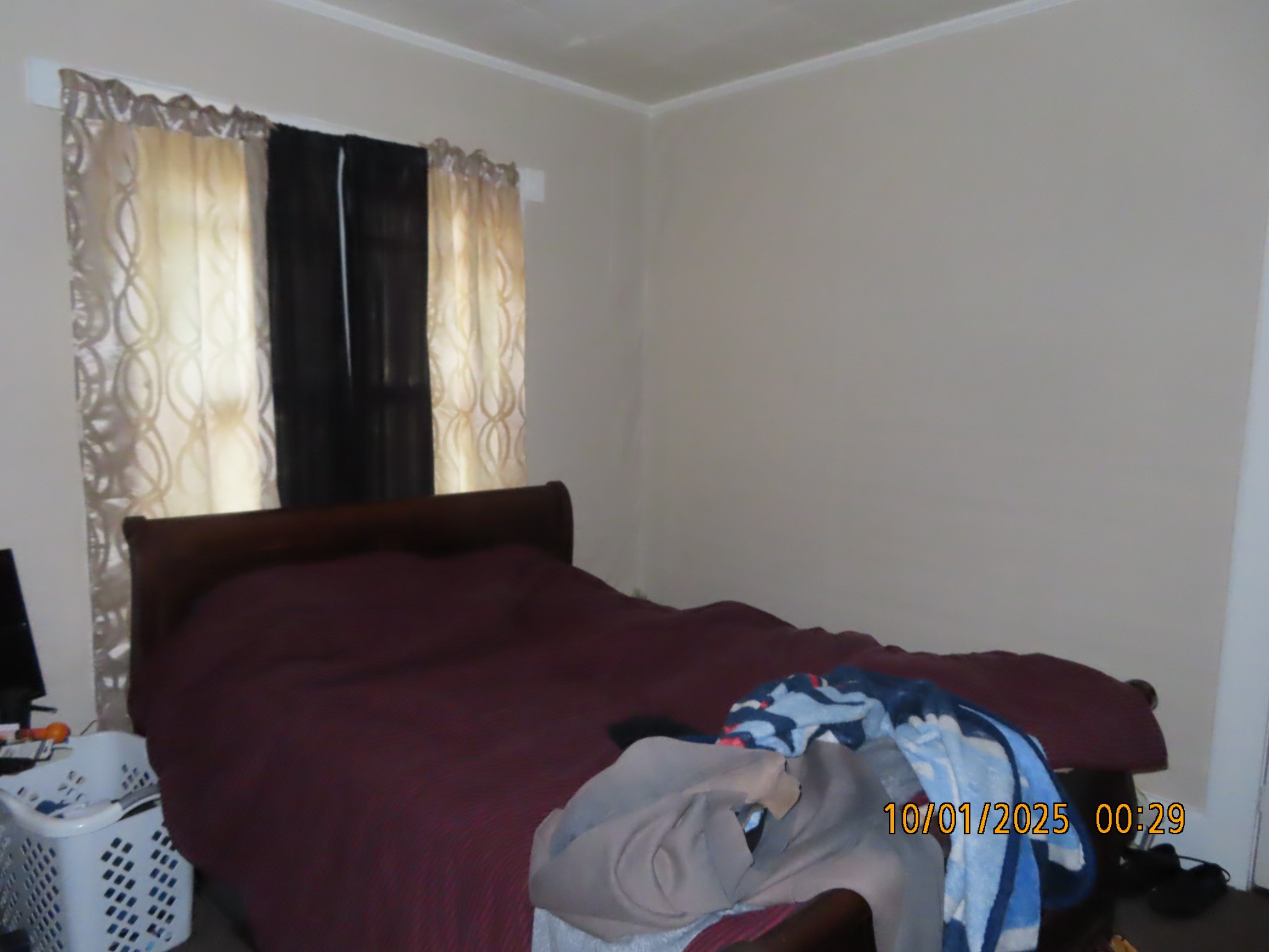 124 Taylor Street Jackson, TN 38301 - Photo 7 of 10 a bedroom with a bed and a window