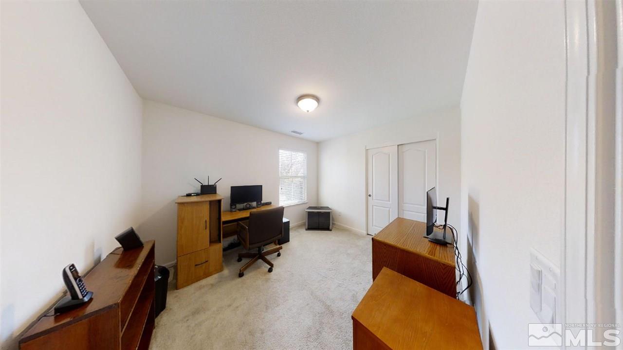 335 Teramo Drive Reno, NV 89521 - Photo 17 of 21 a view of a workspace with furniture and a window