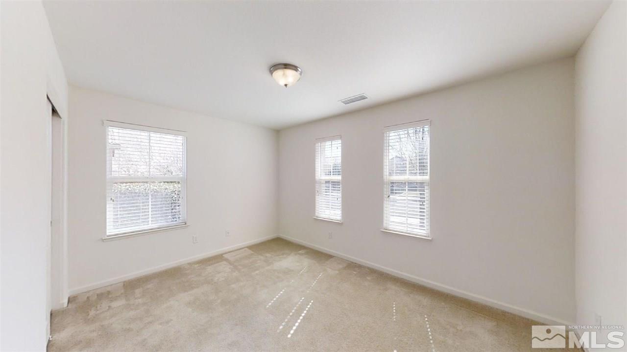 335 Teramo Drive Reno, NV 89521 - Photo 18 of 21 an empty room with windows