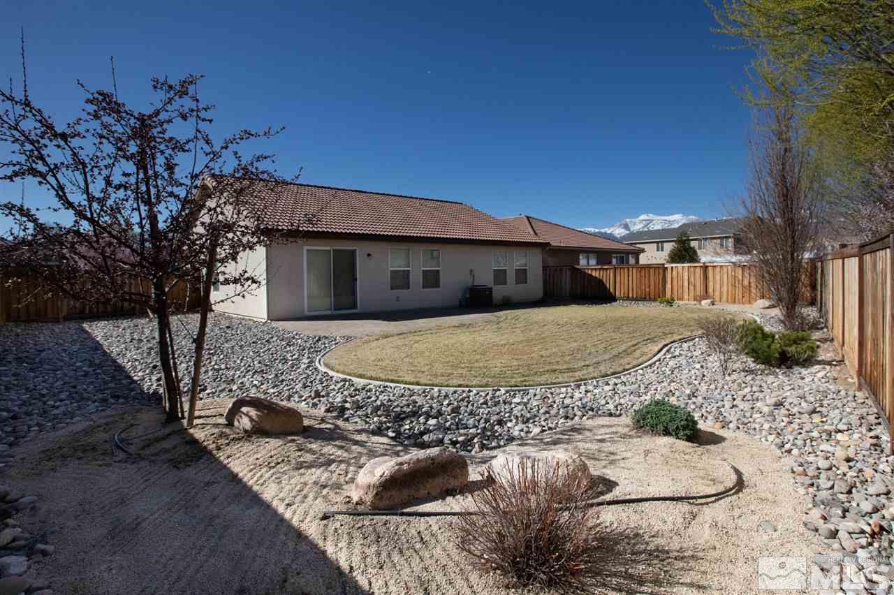 335 Teramo Drive Reno, NV 89521 - Photo 20 of 21 a view of a house with a yard