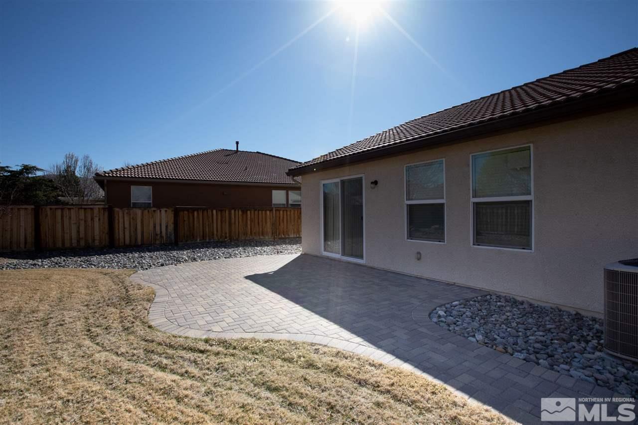 335 Teramo Drive Reno, NV 89521 - Photo 21 of 21 a front view of a house with a yard