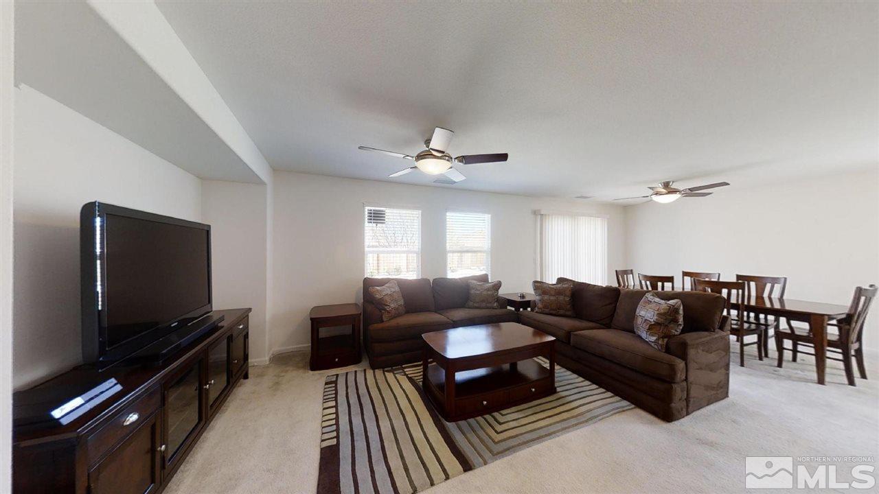 335 Teramo Drive Reno, NV 89521 - Photo 7 of 21 a living room with furniture and a flat screen tv
