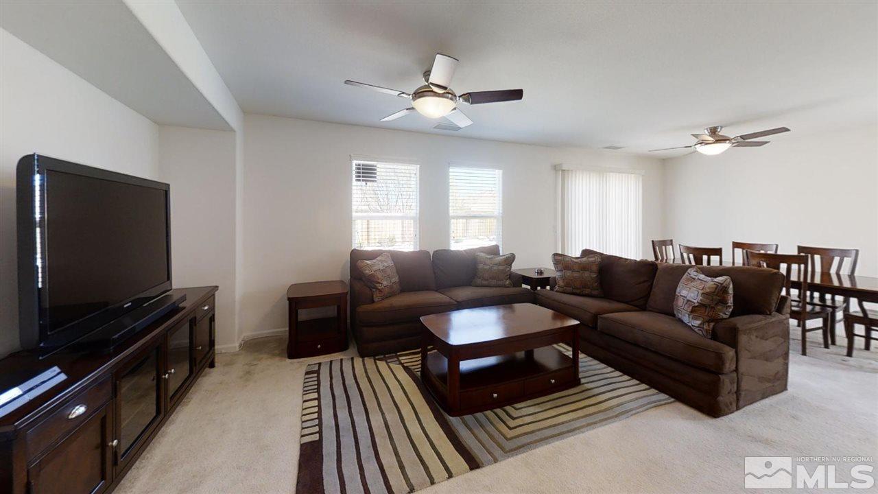 335 Teramo Drive Reno, NV 89521 - Photo 8 of 21 a living room with furniture and a flat screen tv
