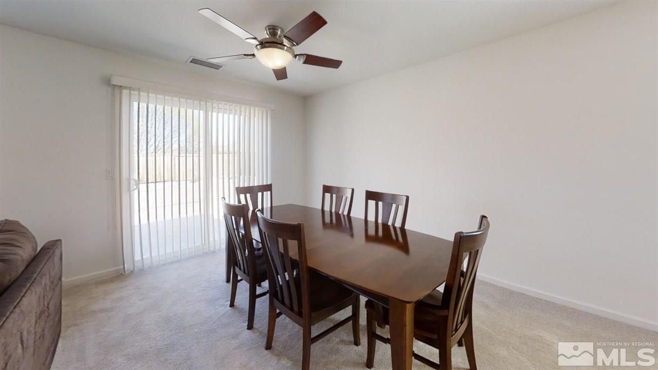 335 Teramo Drive Reno, NV 89521 - Photo 9 of 21 a view of a dining room with furniture and a window