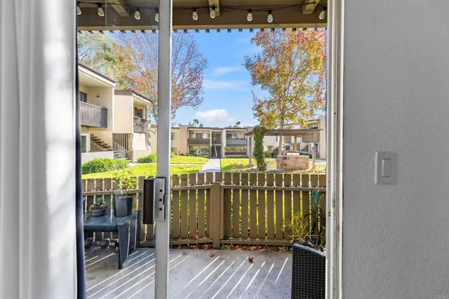 a view of a balcony with wooden floor