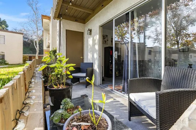 a front view of a house with outdoor seating