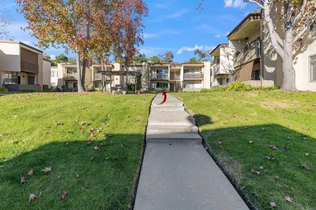a view of a house with a yard porch and sitting area