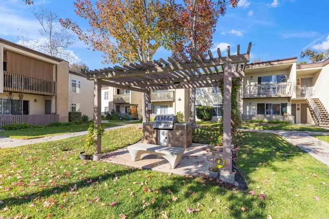 a view of a swimming pool with outdoor seating