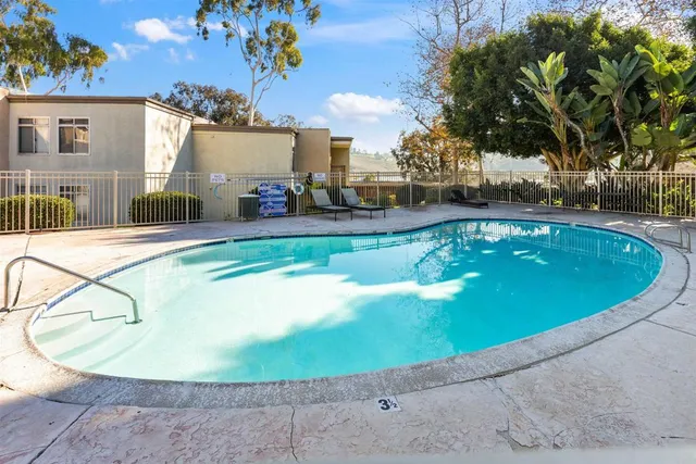 a view of a swimming pool with a patio