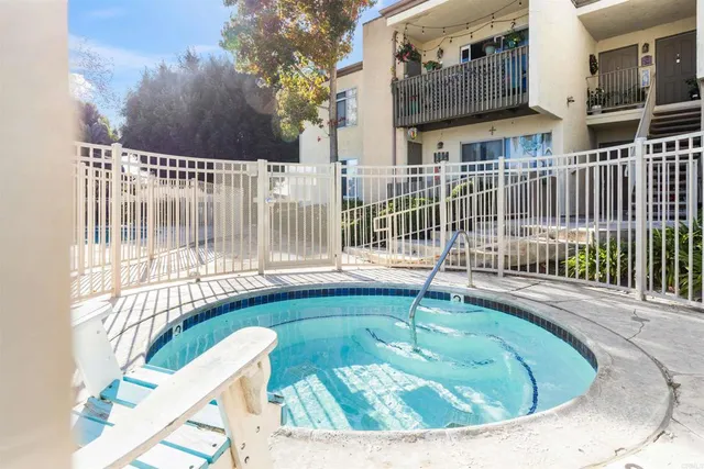 a view of a house with backyard porch and sitting area