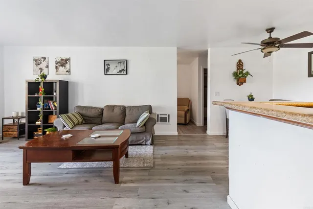 a living room with furniture and a table