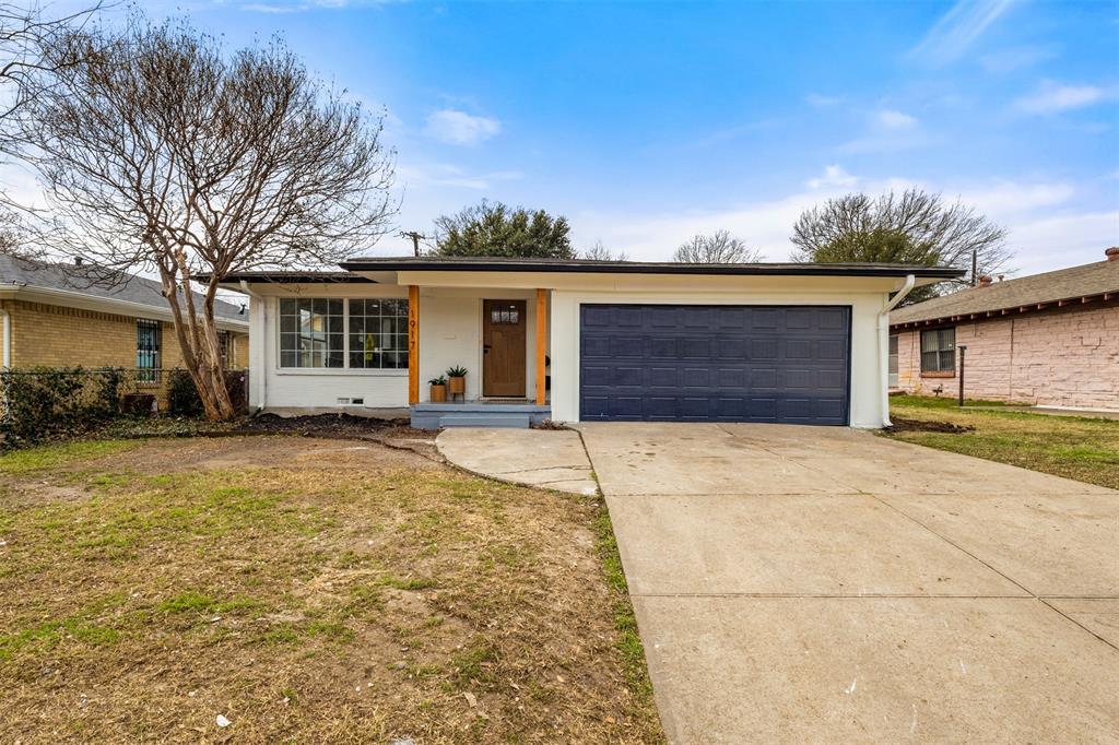 1917 South Vernon Avenue Dallas, TX 75224 - Photo 1 of 28 Single-story residence featuring a white exterior, dark blue garage door, and a brown wood-finish entry door with side windows