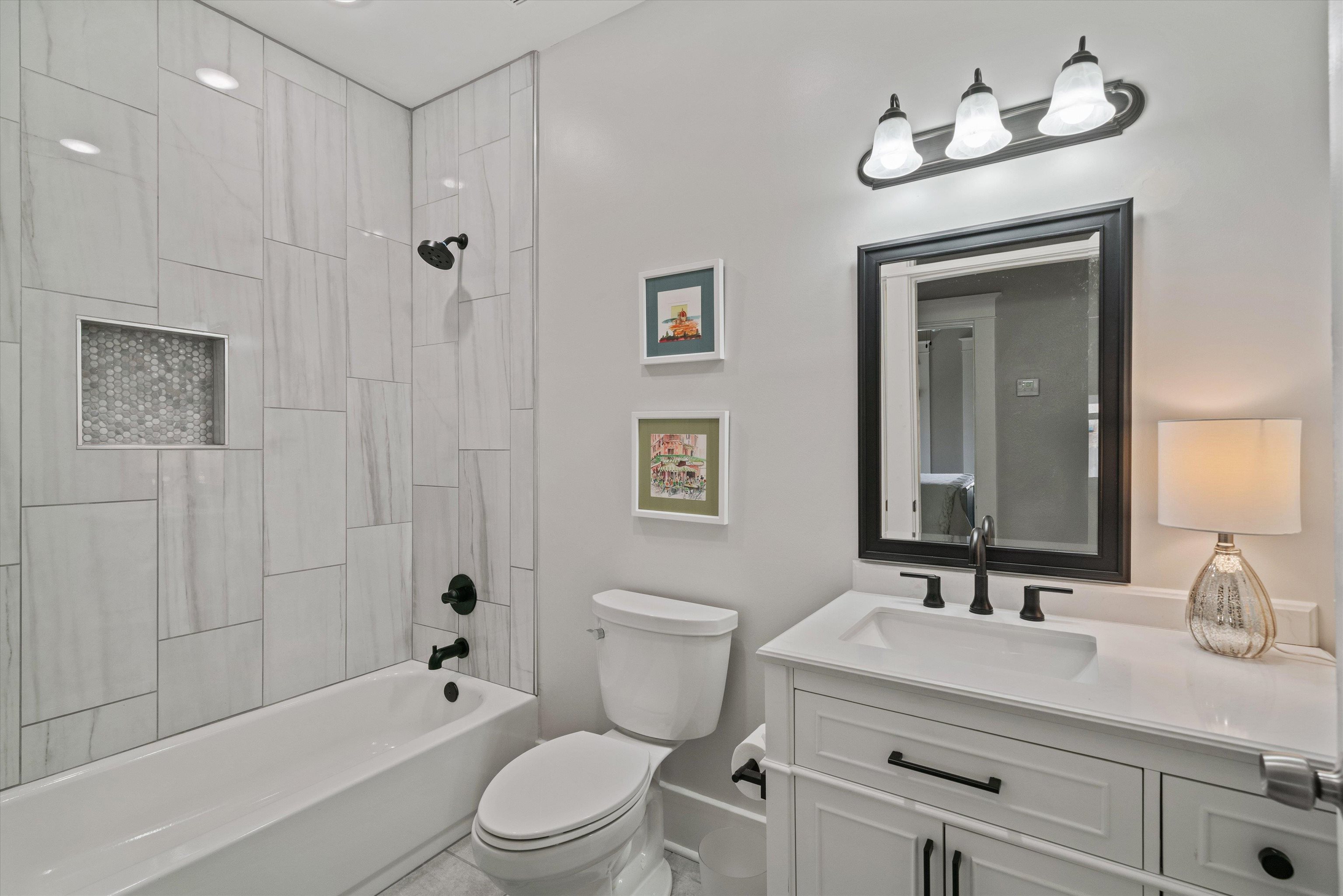 1893 Felix Avenue Memphis, TN 38114 - Photo 17 of 25 a bathroom with a sink a toilet and shower