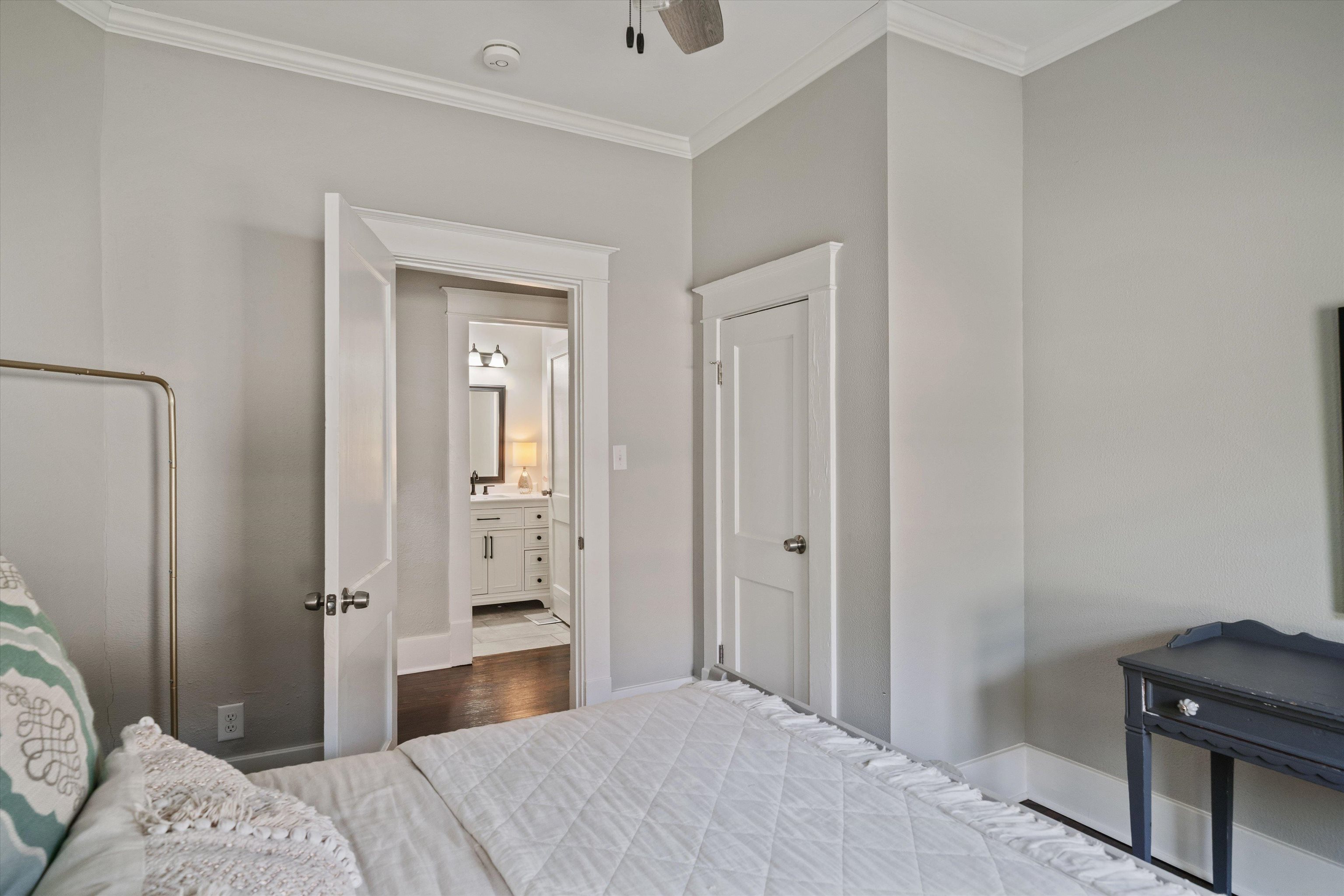 1893 Felix Avenue Memphis, TN 38114 - Photo 19 of 25 a bedroom with a bed and a lamp on the dresser