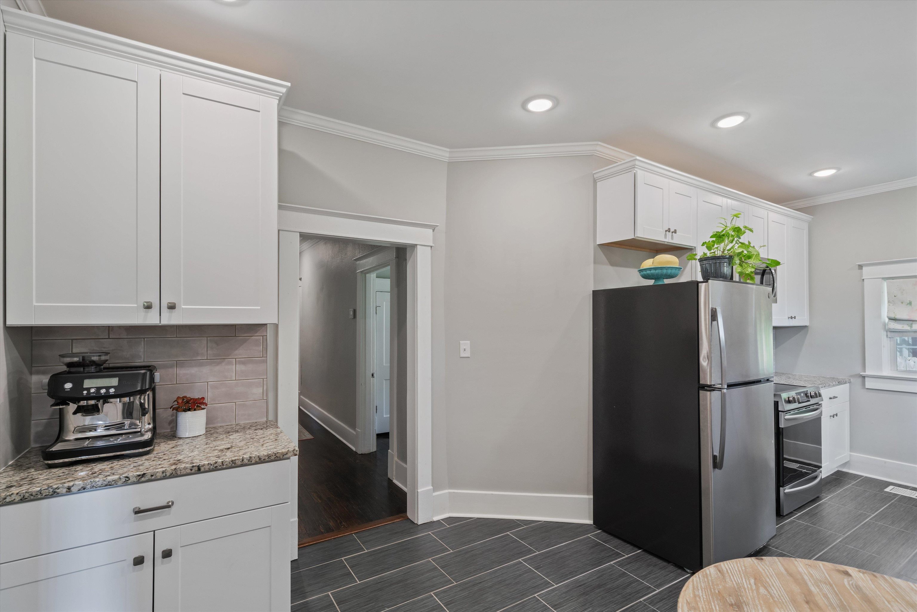 1893 Felix Avenue Memphis, TN 38114 - Photo 7 of 25 a kitchen with stainless steel appliances granite countertop a refrigerator and a sink