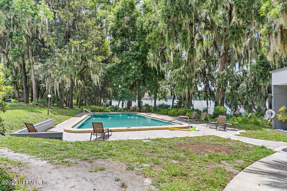 2628 Southwest 14th Drive, Unit 326 Gainesville, FL 32608 - Photo 13 of 17 a view of outdoor space with playground and green space