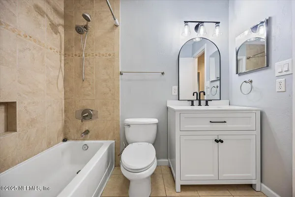 a bathroom with a sink a toilet and a bathtub