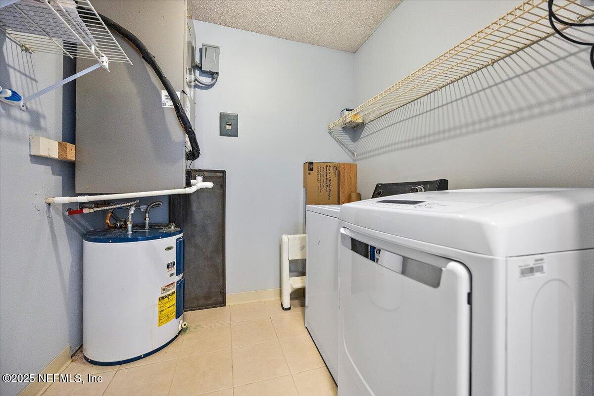 2628 Southwest 14th Drive, Unit 326 Gainesville, FL 32608 - Photo 9 of 17 a utility room with dryer and washer