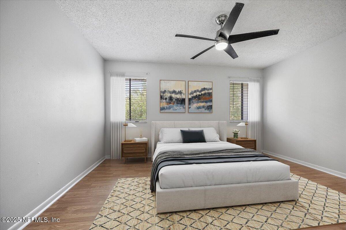 2628 Southwest 14th Drive, Unit 326 Gainesville, FL 32608 - Photo 10 of 17 a bedroom with a bed and window