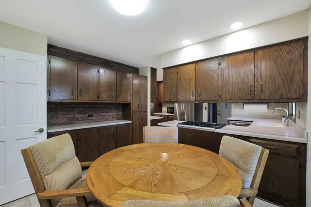 a kitchen with a sink cabinets and appliances