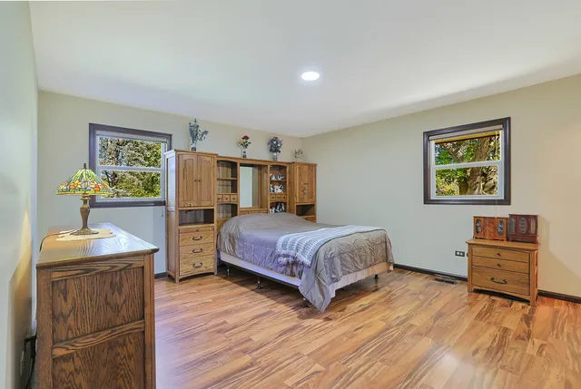 a bedroom with a bed and a dresser