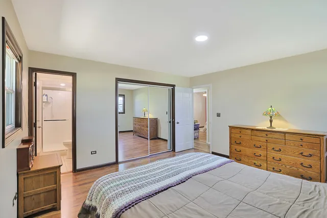 a bedroom with a bed and a dresser