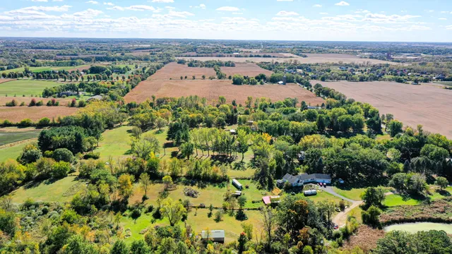 a view of a house with a big yard