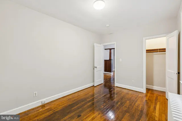 a view of hallway with wooden floor