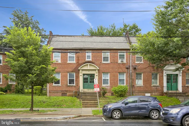 a car parked in front of a house