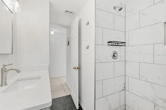 a bathroom with a sink and a shower