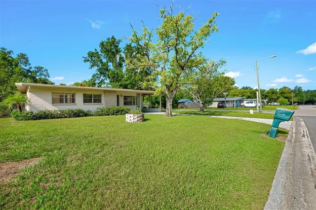 a view of a house with a big yard
