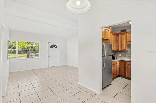 a view of a kitchen cabinets and empty room