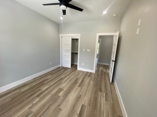 116 Field Street Luling, TX 78648 - Photo 4 of 33 A cozy bedroom with a modern ceiling fan and durable vinyl plank flooring throughout.