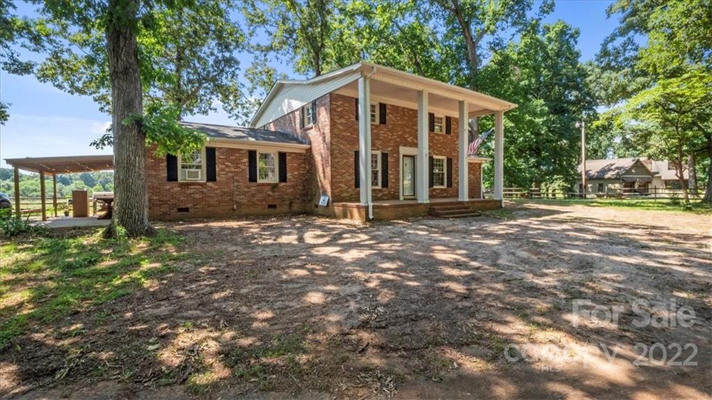 4410 Ansonville Road Marshville, NC 28103 - Photo 1 of 47 a front view of a house with a yard