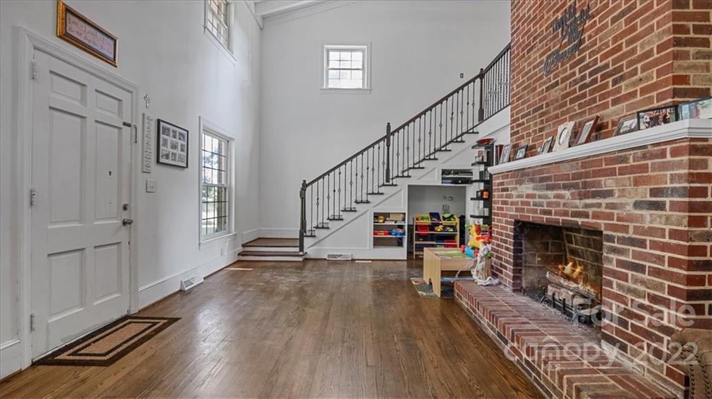 4410 Ansonville Road Marshville, NC 28103 - Photo 11 of 47 a view of a livingroom with wooden floor and a fireplace