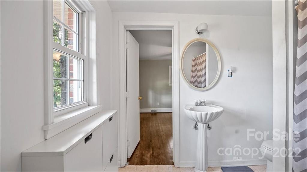 4410 Ansonville Road Marshville, NC 28103 - Photo 29 of 47 a bathroom with a toilet and a mirror