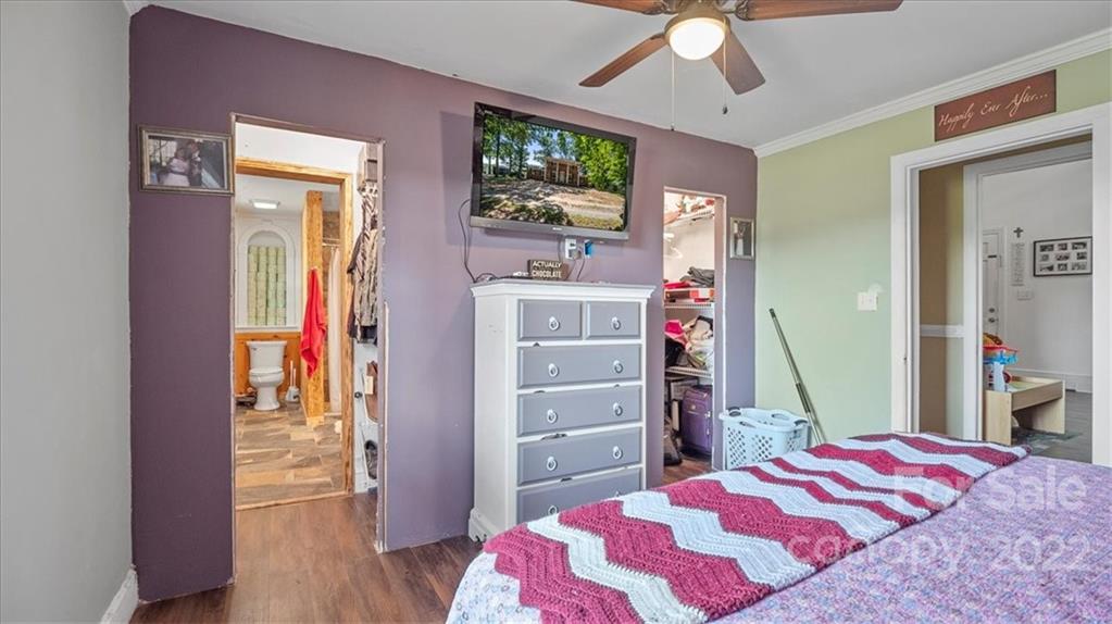 4410 Ansonville Road Marshville, NC 28103 - Photo 38 of 47 a bedroom with a bed and a flat screen tv