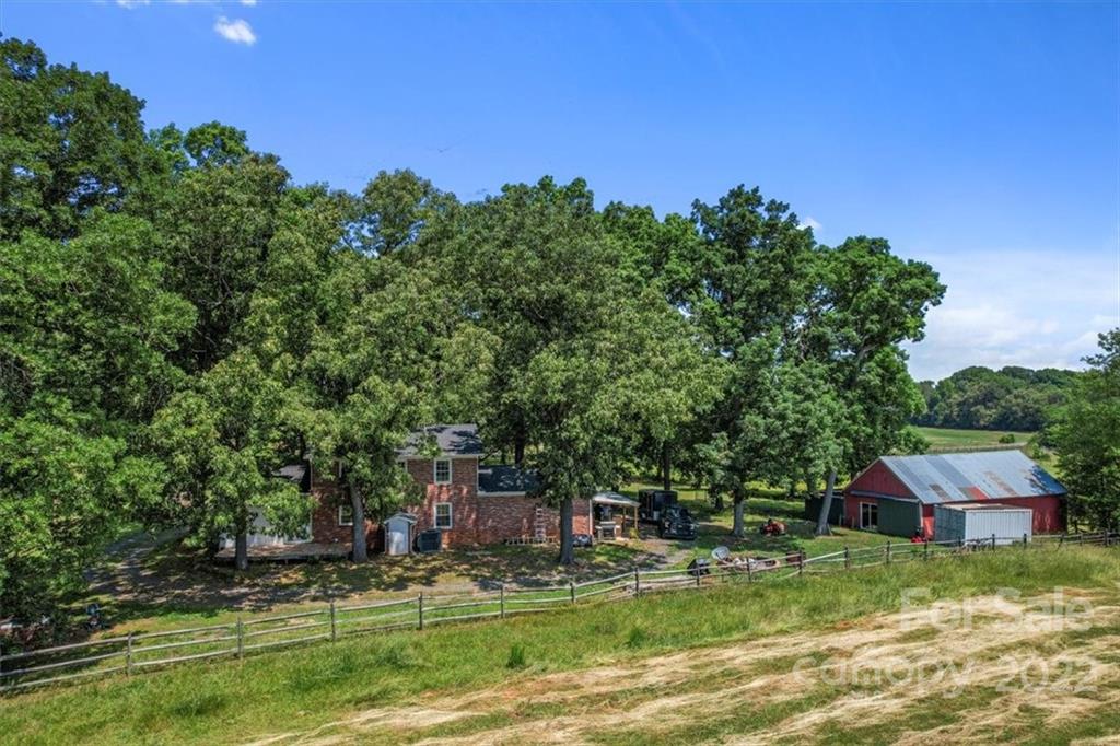 4410 Ansonville Road Marshville, NC 28103 - Photo 45 of 47 a backyard of a house with lots of green space and outdoor seating