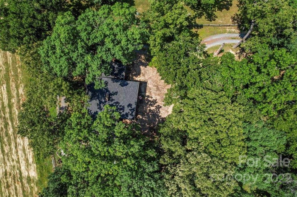 4410 Ansonville Road Marshville, NC 28103 - Photo 47 of 47 an aerial view of a house with a yard and large trees