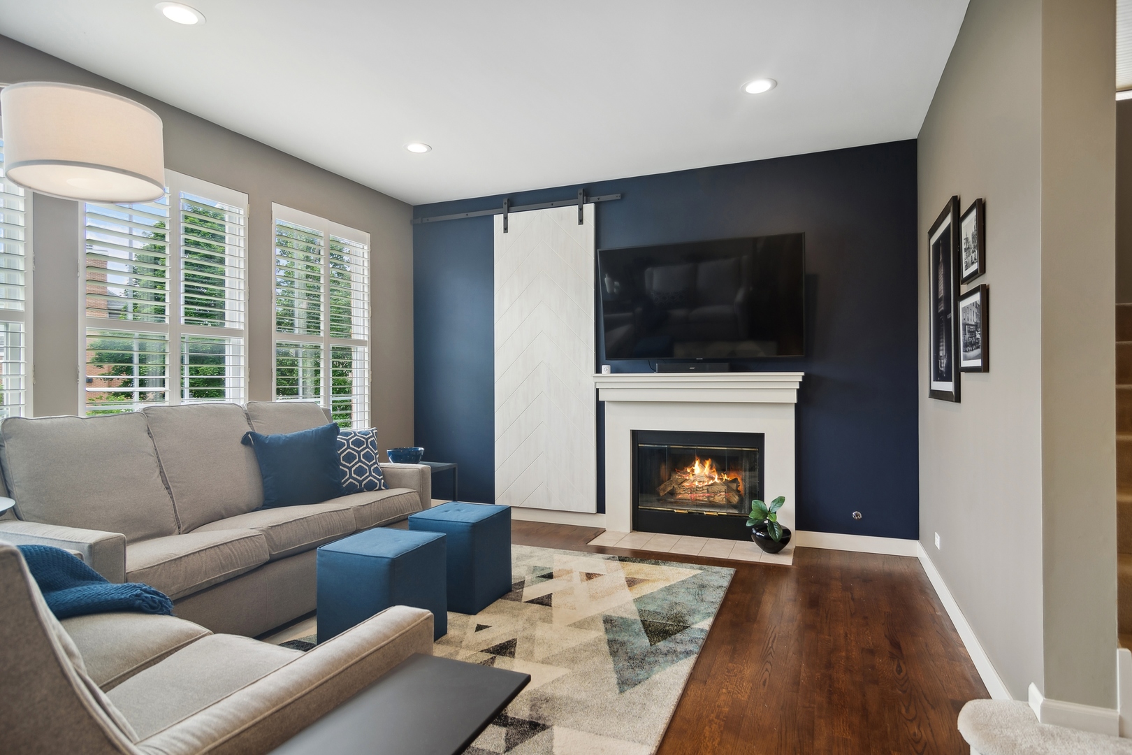 571 Quaker Ridge Court Vernon Hills, IL 60061 - Photo 4 of 17 a living room with furniture a flat screen tv and a fireplace