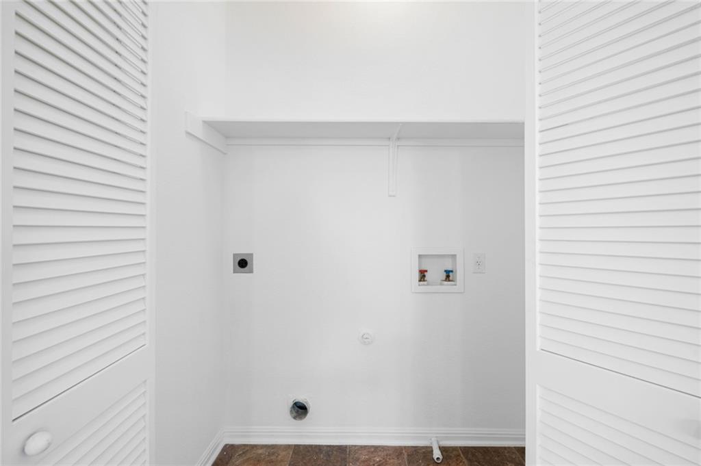 5608 Netleaf Road Austin, TX 78724 - Photo 22 of 26 A dedicated laundry space provides practical utility with easy hookups.