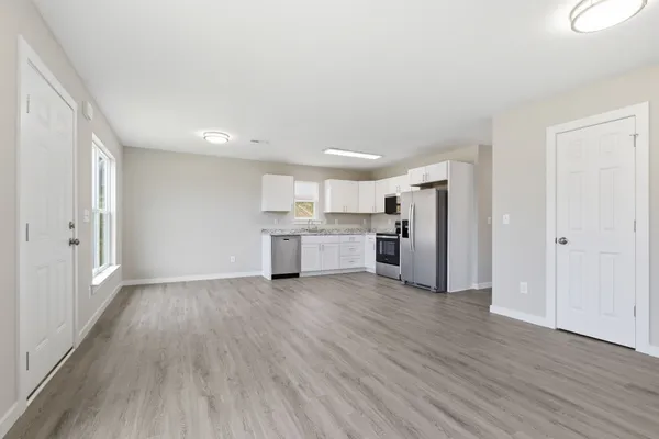 a view of kitchen with wooden floor